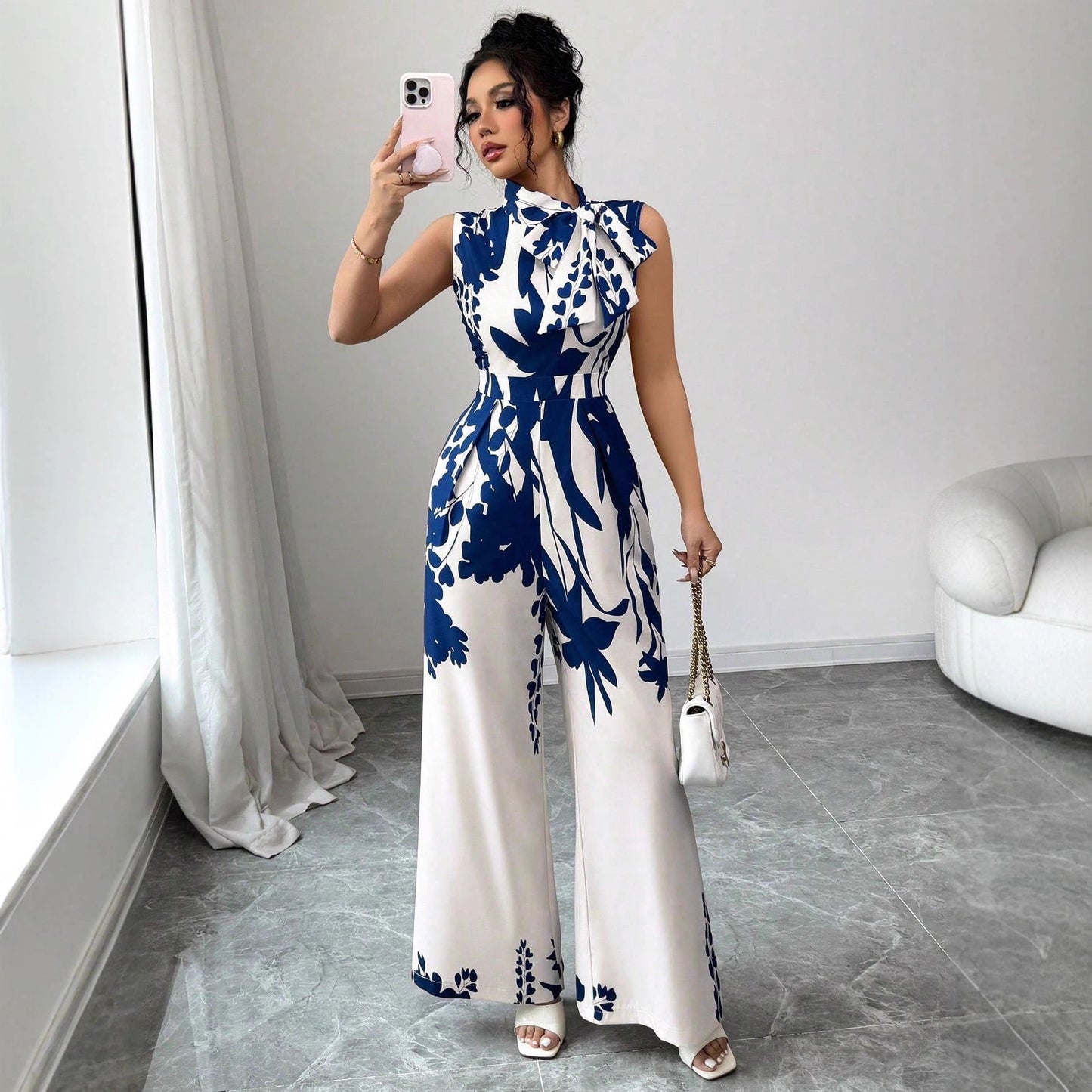 Eleganter ärmelloser Damen-Jumpsuit mit weitem Bein, Blumendruck und Schnürdetails