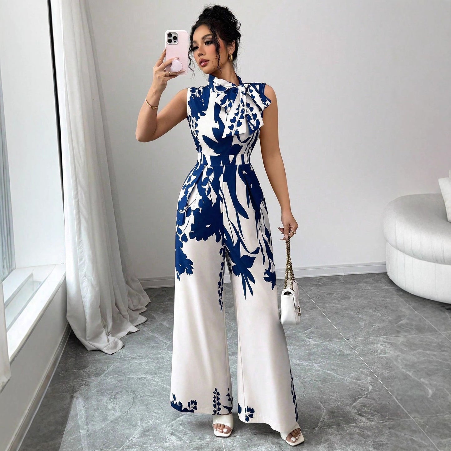 Eleganter ärmelloser Damen-Jumpsuit mit weitem Bein, Blumendruck und Schnürdetails